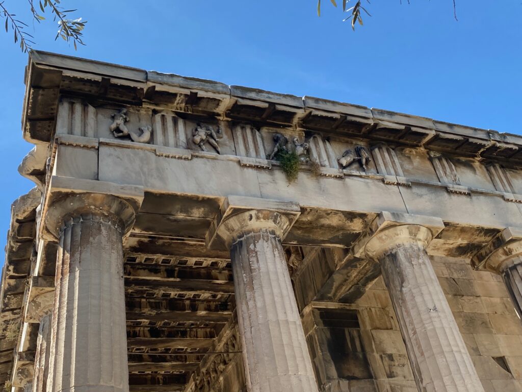 close up of some of the art on the old columns--a lot of naked people