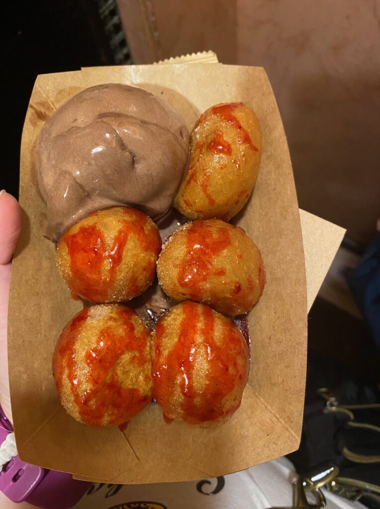 loukoumodes! small donut hole type desserts with a strawberry drizzle and chocolate ice cream