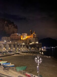 Atrani from a distance at night. It is lit up and very pretty